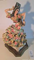 Front view of porcelain flamenco dancer figurine on base