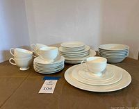 Full dinnerware set stacked showing all 30 pieces