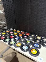 Full view of approx. 30 vinyl 45s spread on table