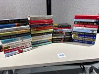 All 38 Danielle Steel hardcovers stacked on table