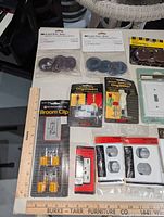 Overview of packaged discs, organizer clips, broom clip, wall plates