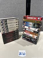 Overall lot showing two boxed sets and stack of individual VHS tapes