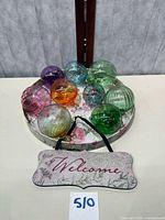 Eight glass spheres, hanging plaque and tray overview