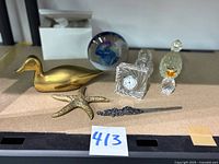 Group shot of all eight decorative items on shelf