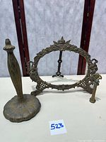 Group shot of frame, stand and statue