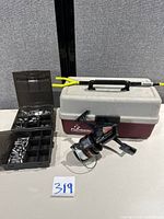 Overall lot showing tackle box, sinker case, reel and Fishin’ Stix