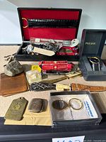 Overall lot including display case, Pulsar watch, wallet, train car and small boxed items