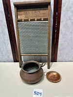 Group shot of Northern Queen washboard, copper pot, copper dish