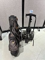 Ogio bag alongside folded High-Roller cart
