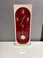 Full frontal view of Verichron lucite wall clock showing overall design and size