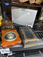 All three items on shelf: weather station, Seth Thomas boxed clock, Holy Bible book box