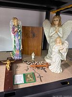 Group shot showing angels, crucifix, relic, bible box and rosary