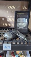 Westinghouse watthour meter and ShopCraft drill on shelf