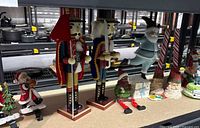 Group shot showing nutcrackers, Santa figures, snowmen, candleholders, music box