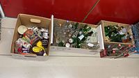 Cardboard boxes with mixed bottles and cans