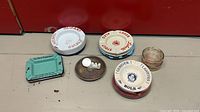 Six assorted ashtrays including Olifant, Frontenac, Bols, glass piece and others