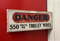 Front view of entire sign showing text and wear