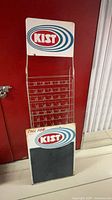 Full view of Kist wire display rack with separate chalkboard sign