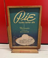 Full view of the countertop sign in wooden holder