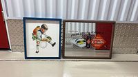 Both framed Orange Crush advertisements side by side