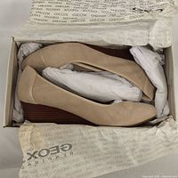 New Geox woman's shoes in beige goat suede inside original Geox branded box, stuffed with paper to maintain shape.