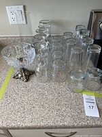 Full view of all glassware including the crystal bowl and various drinking glasses on a counter