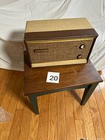 Front three-quarter view of amplifier showing cabinet and control layout