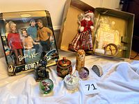 All items laid out including Barbie & Ken Star Trek set, Jewel Princess Barbie with box parts, small decorative items, mineral pieces