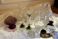 Group shot showing all glass pieces, nutcracker and number 70 tag