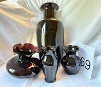 Group shot of four amethyst glass vases