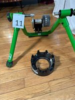 Overall view of green Kinetic trainer frame and separate riser block