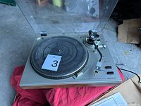 Top view of Sanyo TP 80 turntable showing platter, tonearm, dust cover