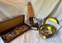Overview of lot with figurines, wood box of medals, brass bowl of badges