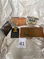 Group shot showing all five vintage bar signs