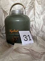 Full view of green Vagabond water cooler jug with handle, lid and spigot