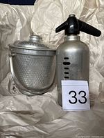 Ice bucket and seltzer bottle together for scale and completeness