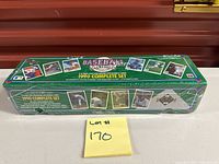 Front angle showing sealed green box labeled 1990 Complete Set
