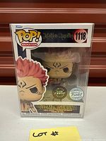 Front view showing figure, box art, stickers glow-in-the-dark and special edition