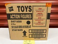 Front of sealed Hasbro case showing model E4071AS00 and 8 pcs detail