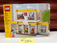 Front of sealed LEGO 40574 Brand Store box showing model and piece count