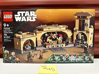 Front of sealed LEGO Star Wars Boba Fett's Throne Room set 75326 showing artwork and minifigures