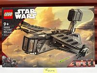 Front of box showing full artwork of The Justifier starship, piece count and minifigures lineup