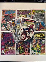 Group shot of all bagged Amazing Spider-Man comics spread on table