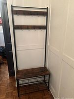 Front view of the free-standing coat rack with bench.