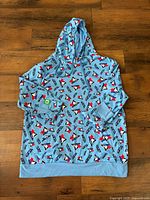 Front view of light blue Blue Jays logo hoodie laid flat