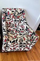 Full front three-quarter view of the Urban Barn armchair showing overall design and pattern