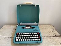 Front view of Smith-Corona Corsair typewriter showing full keyboard and color