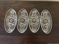 Top view of four oval glass dishes showing starburst pattern