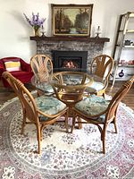 Full view of rattan dining set on rug