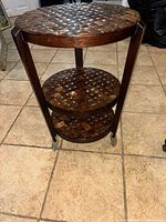 Full view of round two-tier marquetry table